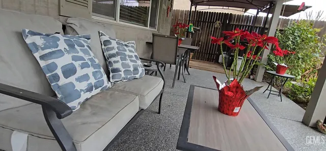 a view of outdoor seating space with furniture