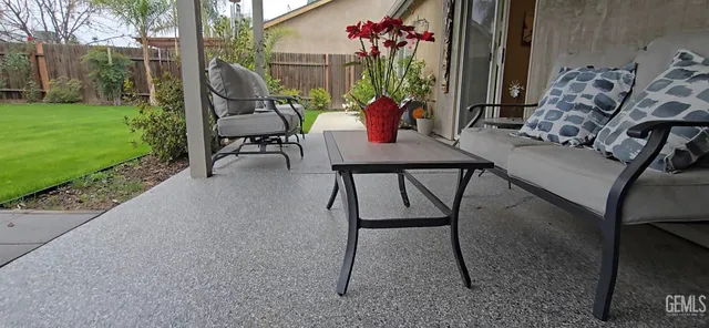 a view of a patio with furniture