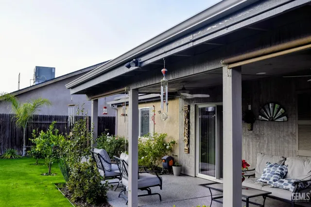 a couple of potted plants in front of door