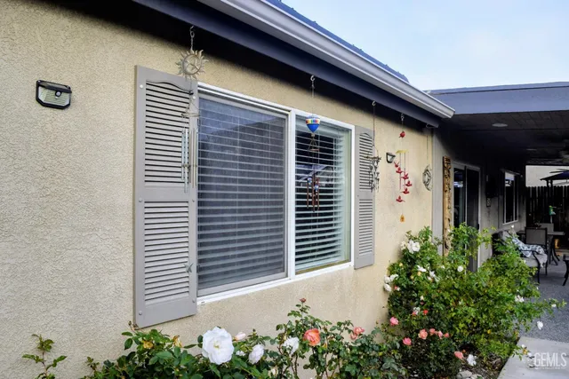 a front view of a house with plants