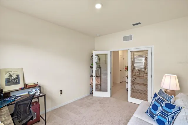 a livingroom with a workspace