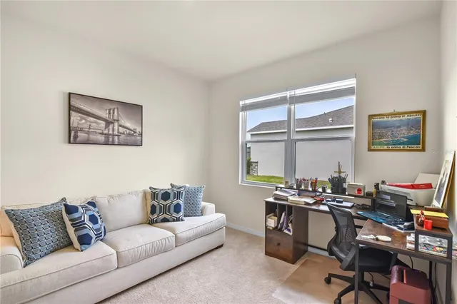 a work room with furniture and a window