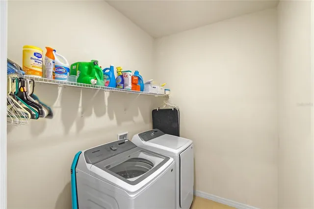 a utility room with dryer and washer