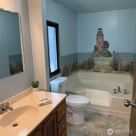 a bathroom with a sink a toilet and a bathtub