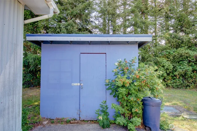 a side view of a house with a yard