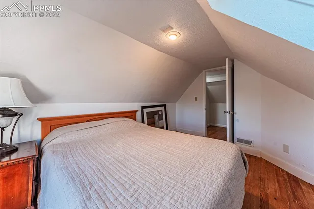 a view of a livingroom with furniture and wooden floor