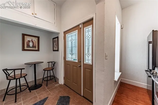 a view of a kitchen with electric appliances