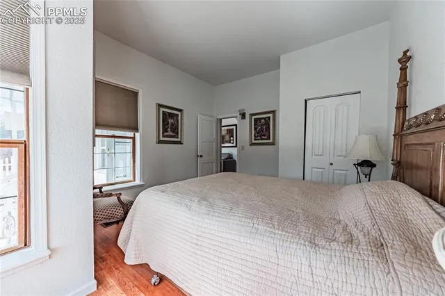 a living room with furniture and a kitchen view