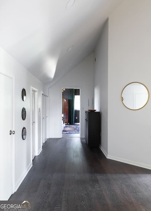 201 Hurt Street Northeast, Unit ENTIRE Atlanta, GA 30307 - Photo 13 of 61 a view of a hallway with wooden floor and a bathroom