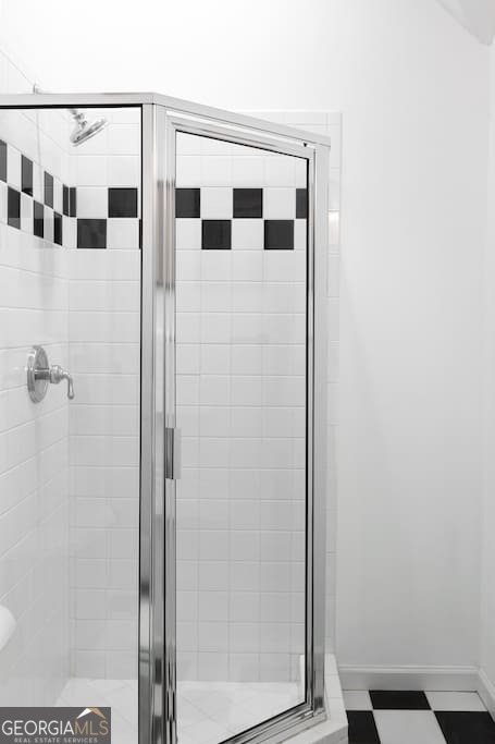 201 Hurt Street Northeast, Unit ENTIRE Atlanta, GA 30307 - Photo 21 of 61 a bathroom with a shower and mirror