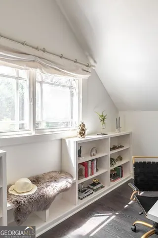 a white bath tub sitting in a en suite bathroom