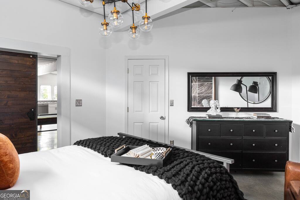 201 Hurt Street Northeast, Unit ENTIRE Atlanta, GA 30307 - Photo 47 of 61 a bedroom with a bed and wooden floor