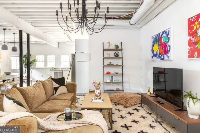 a front view of a house with a garden and plants