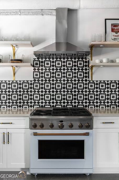 201 Hurt Street Northeast, Unit ENTIRE Atlanta, GA 30307 - Photo 51 of 61 a stove top oven sitting inside of a kitchen