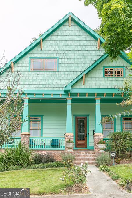 201 Hurt Street Northeast, Unit ENTIRE Atlanta, GA 30307 - Photo 56 of 61 a front view of a house with garden