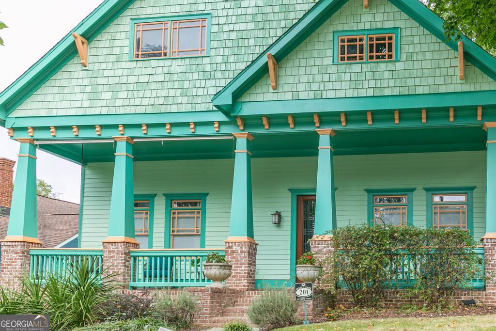 201 Hurt Street Northeast, Unit ENTIRE Atlanta, GA 30307 - Photo 57 of 61 a front view of a house with a yard