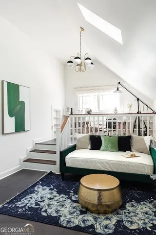 a bedroom with furniture and window