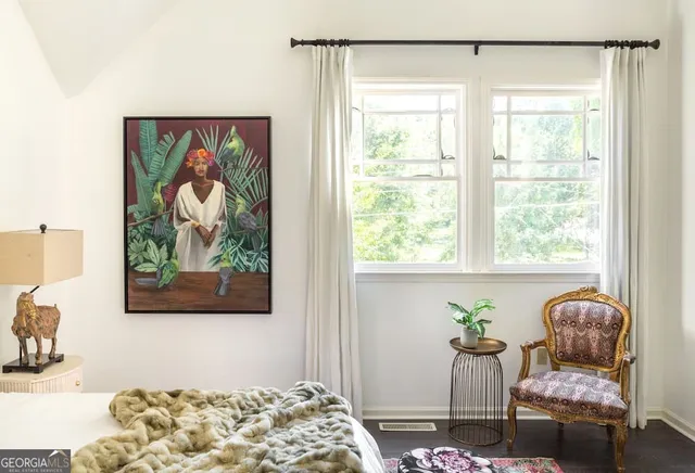 a kitchen with a table chairs sink and cabinets