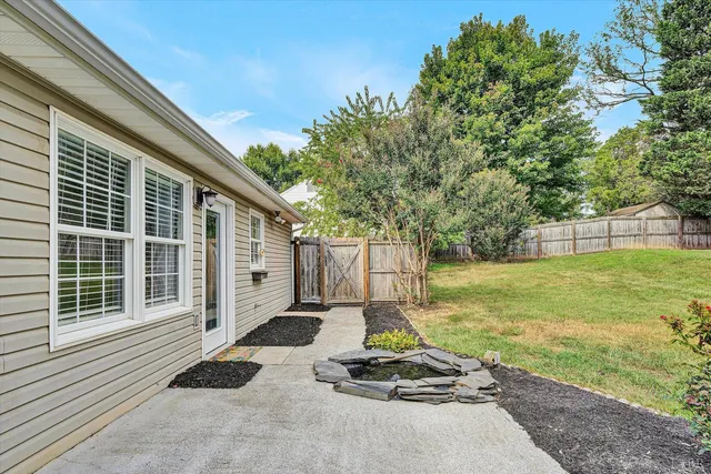 a view of a backyard with a patio