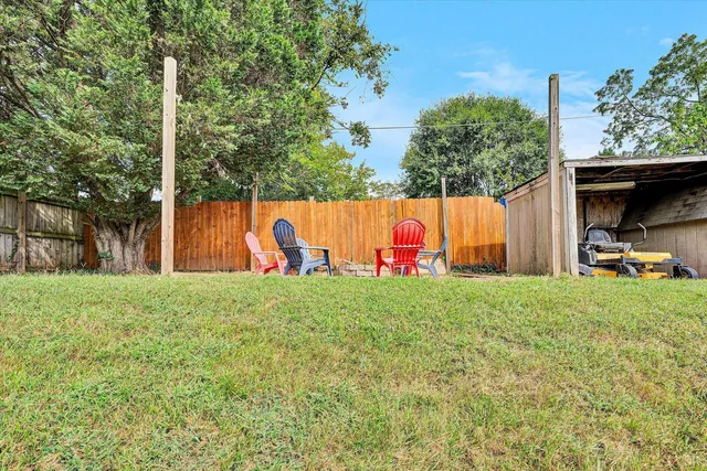 a view of a park with large trees