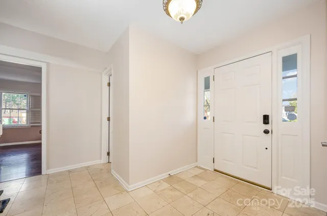 a living room with furniture window and wooden floor