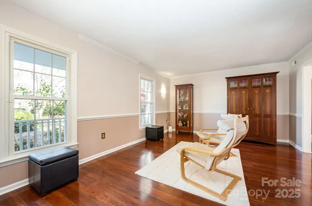 a bathroom with a granite countertop toilet sink and mirror