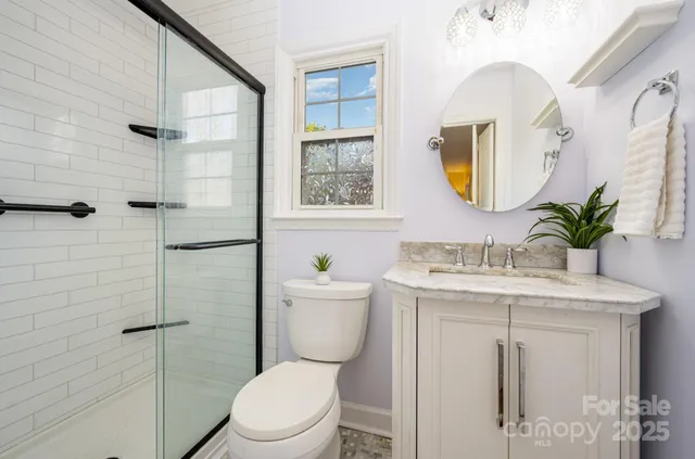 a bedroom with a bed window and a desk