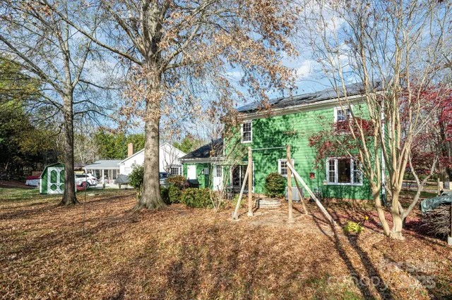 a view of a backyard with sitting area and furniture