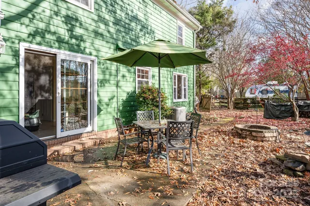 a green field covered with trees in the background