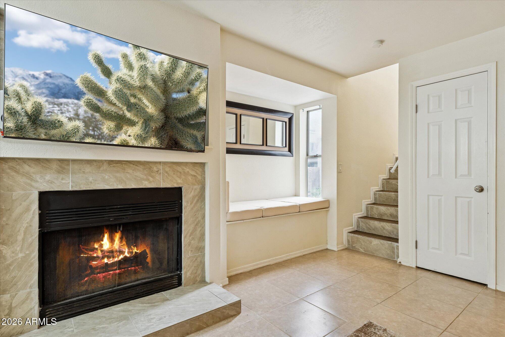 1645 West Baseline Road, Unit 2084 Mesa, AZ 85202 - Photo 3 of 13 Cozy Fireplace and big screen TV