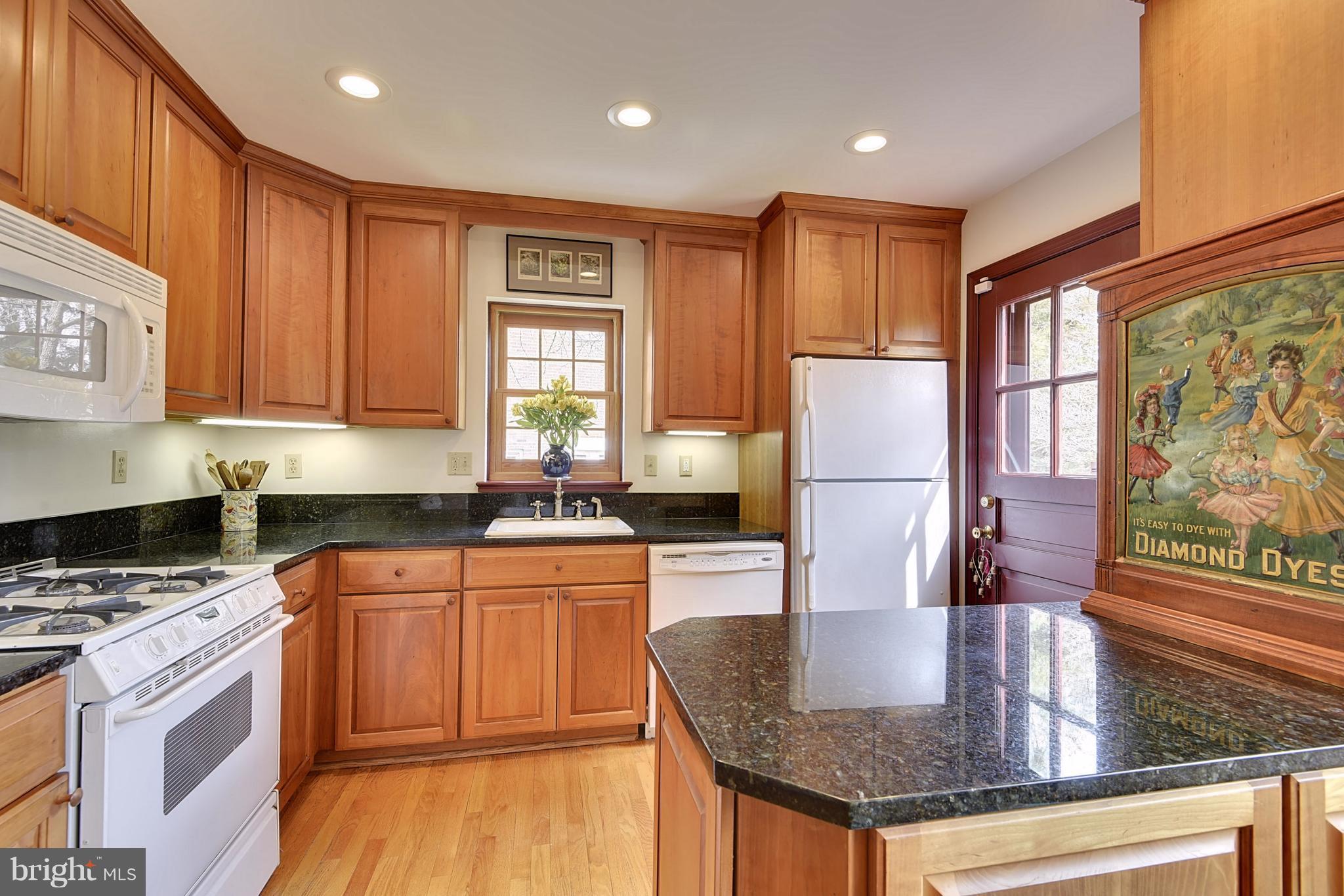4606 Woodfield Road Bethesda, MD 20814 - Photo 3 of 25 Kitchen with Granite Counters and Gas Range