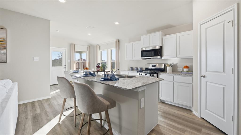 1629 Tin Roof Road Krum, TX 76249 - Photo 33 of 35 Kitchen-All Home and community information, including pricing, included features, terms, availability and amenities, are subject to change at any time without notice or obligation. All Drawings, pictures, photographs, video, square footages, floor plans, elevations, features, colors and sizes are approximate for illustration purposes only and will vary from the homes as built.