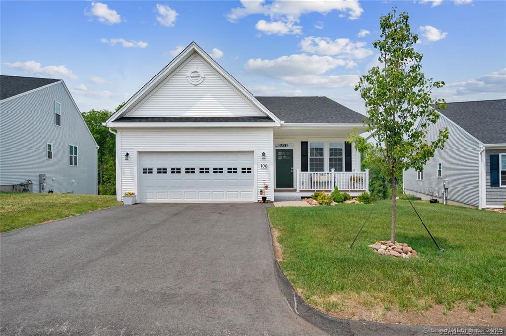 134 Webster Lane, Unit 215 Middletown, CT 06457 - Photo 1 of 1 front view of a house with a yard