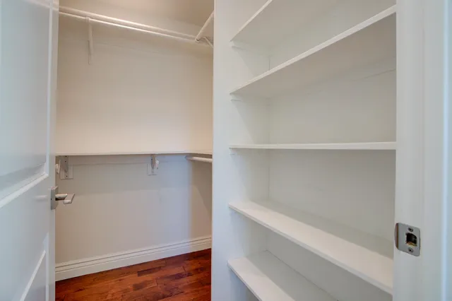 a view of an empty walk in closet