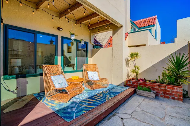 a backyard of a house with seating space