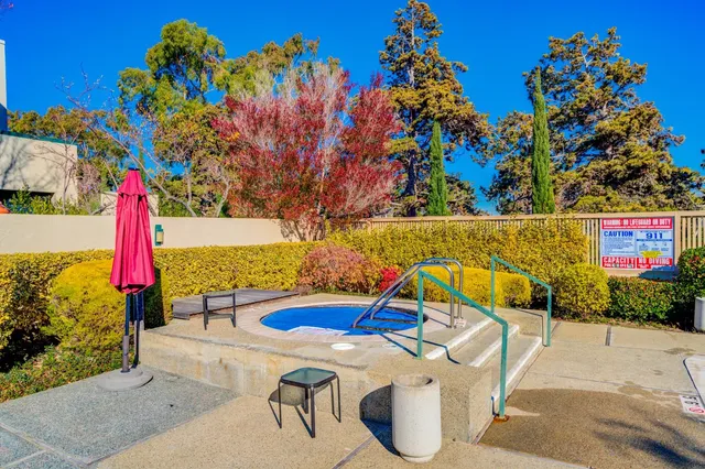 a view of a swimming pool with a patio