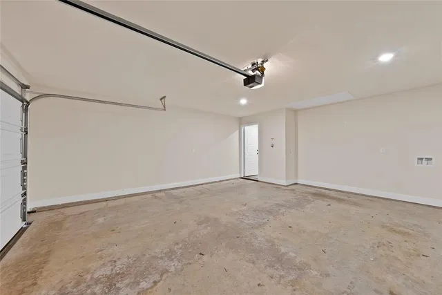 an empty room with ceiling fan and window