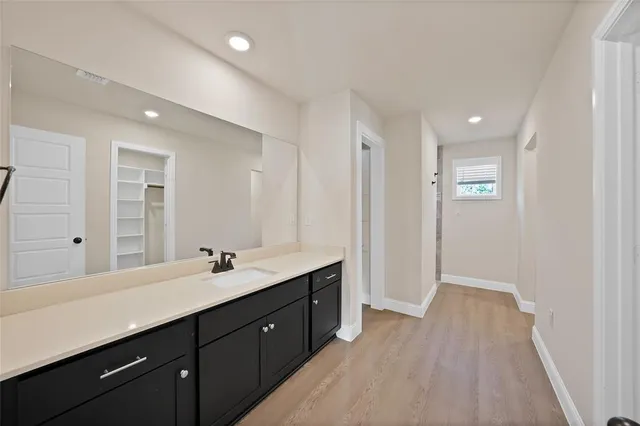 a bathroom with a double vanity sink and mirror