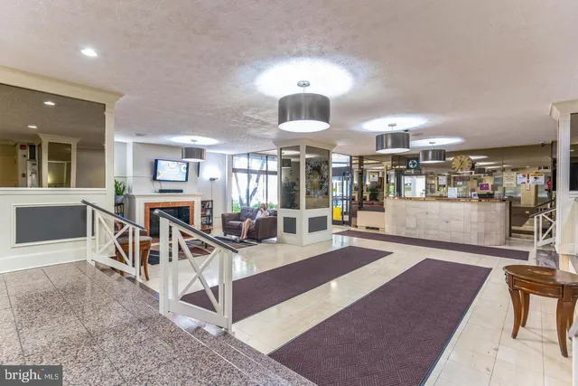 a view of a living room and kitchen