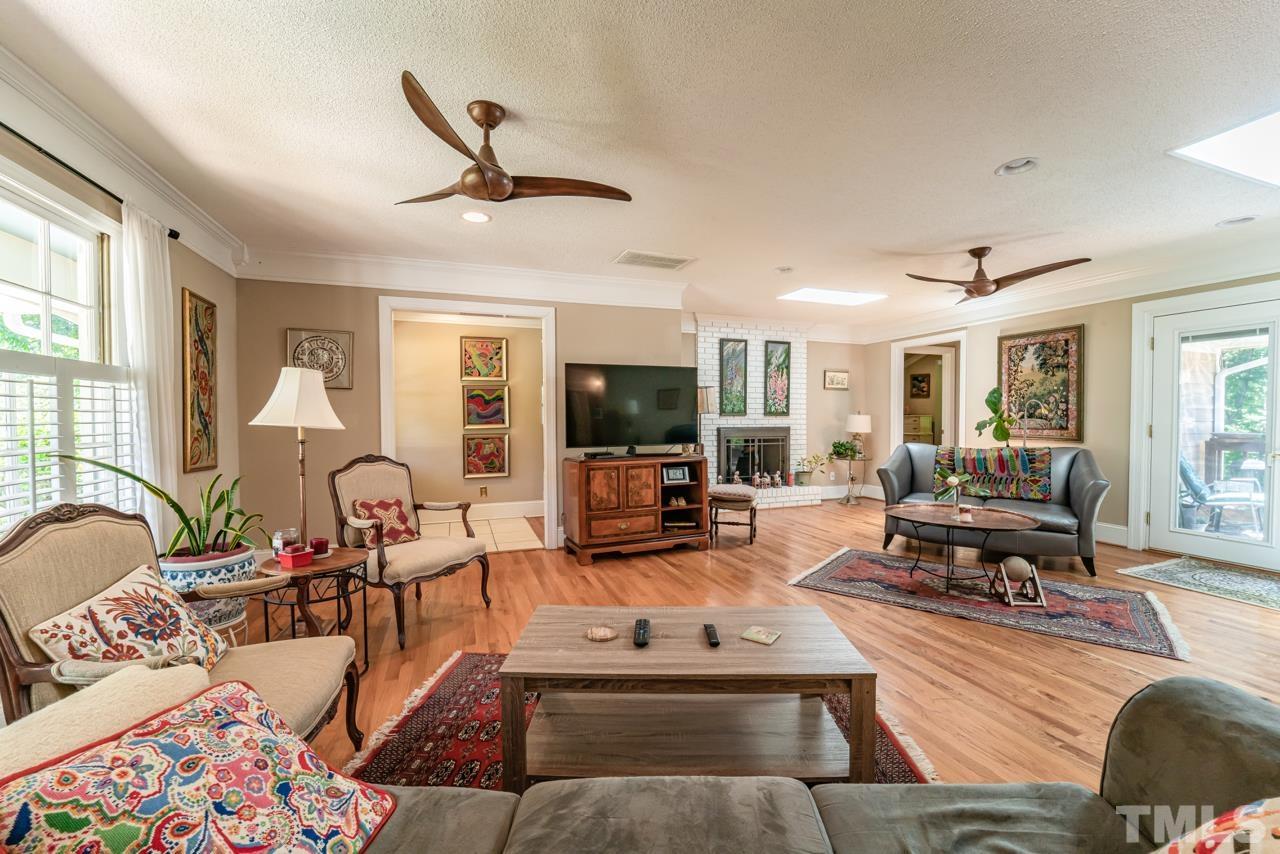 3318 Hampton Road Raleigh, NC 27607 - Photo 11 of 56 a living room with furniture fireplace and flat screen tv