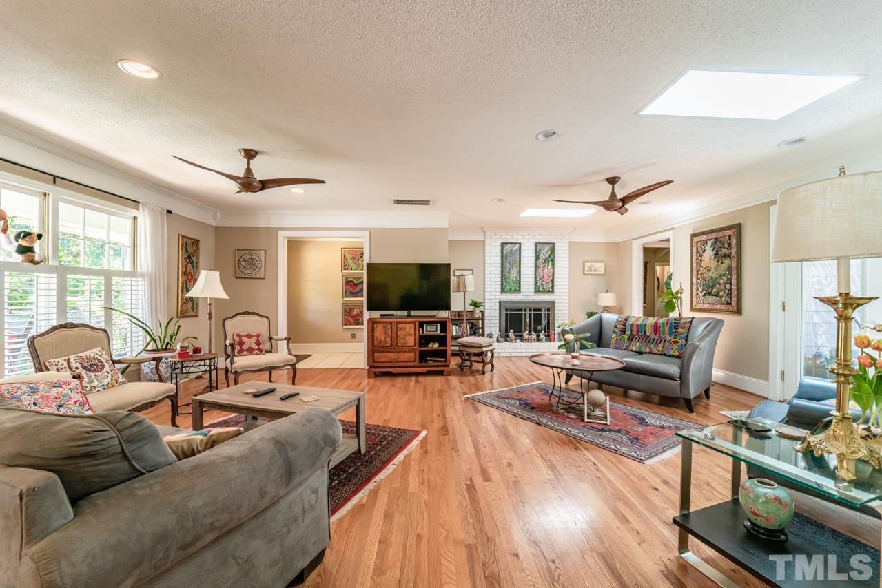 3318 Hampton Road Raleigh, NC 27607 - Photo 13 of 56 a living room with furniture kitchen view and a large window