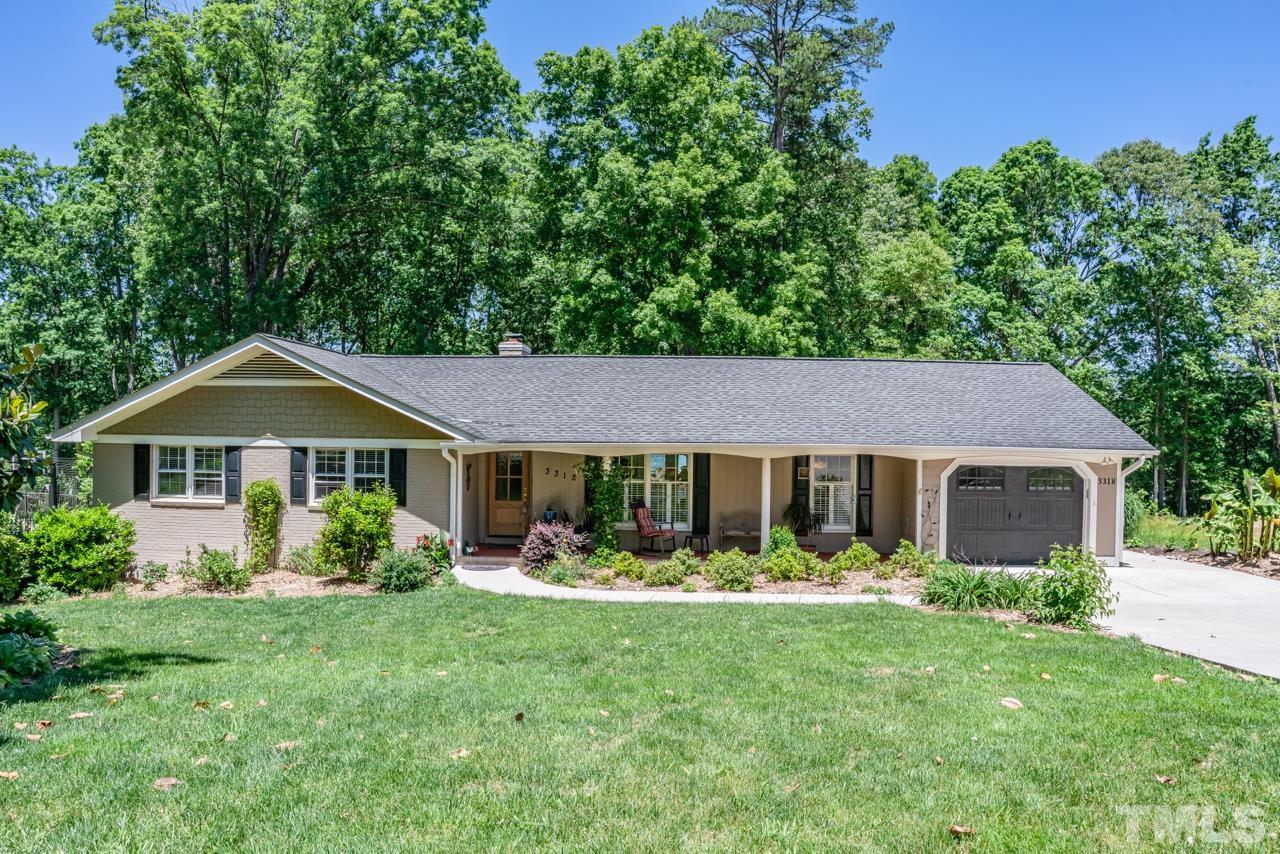 3318 Hampton Road Raleigh, NC 27607 - Photo 2 of 56 a front view of a house with garden
