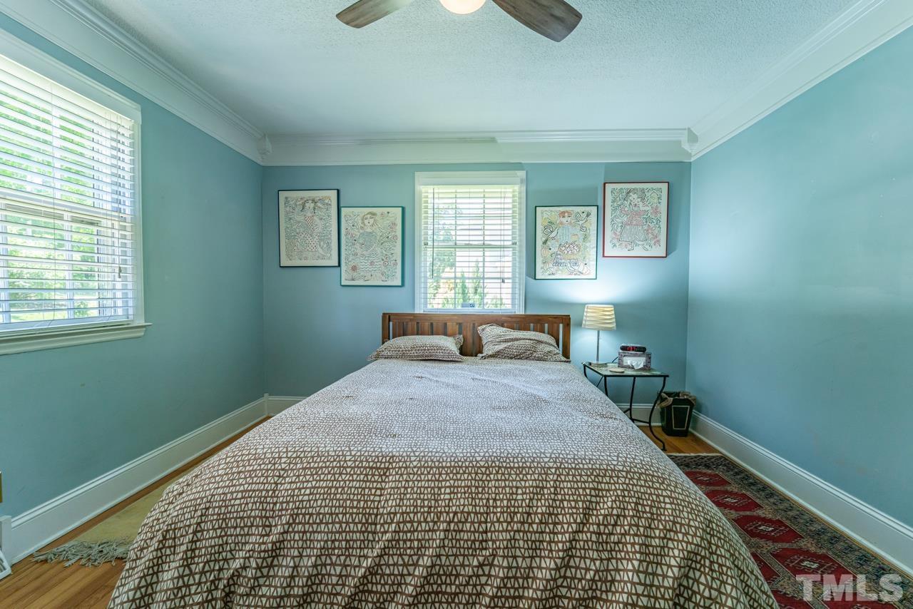 3318 Hampton Road Raleigh, NC 27607 - Photo 27 of 56 a bedroom with a bed and a window