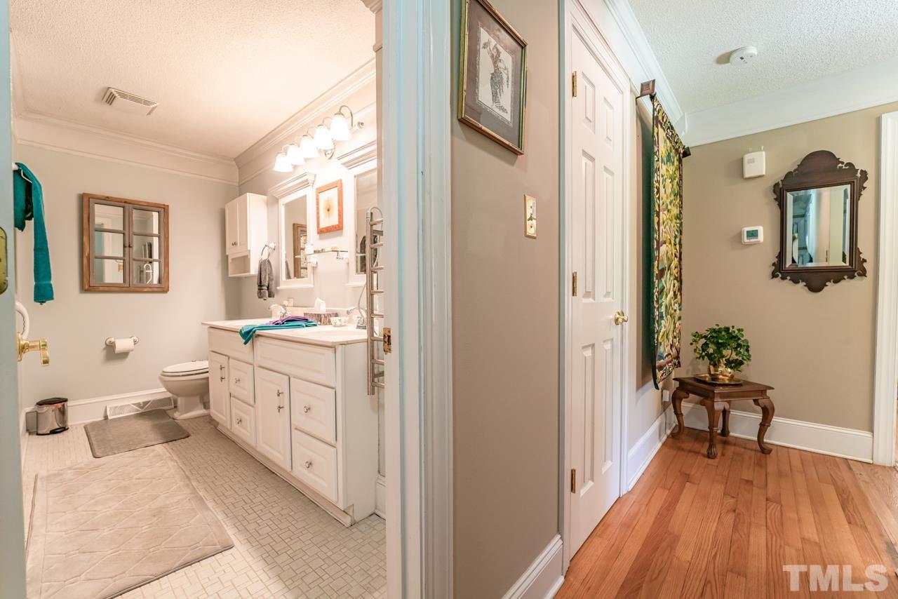 3318 Hampton Road Raleigh, NC 27607 - Photo 29 of 56 a bathroom with a sink and a mirror