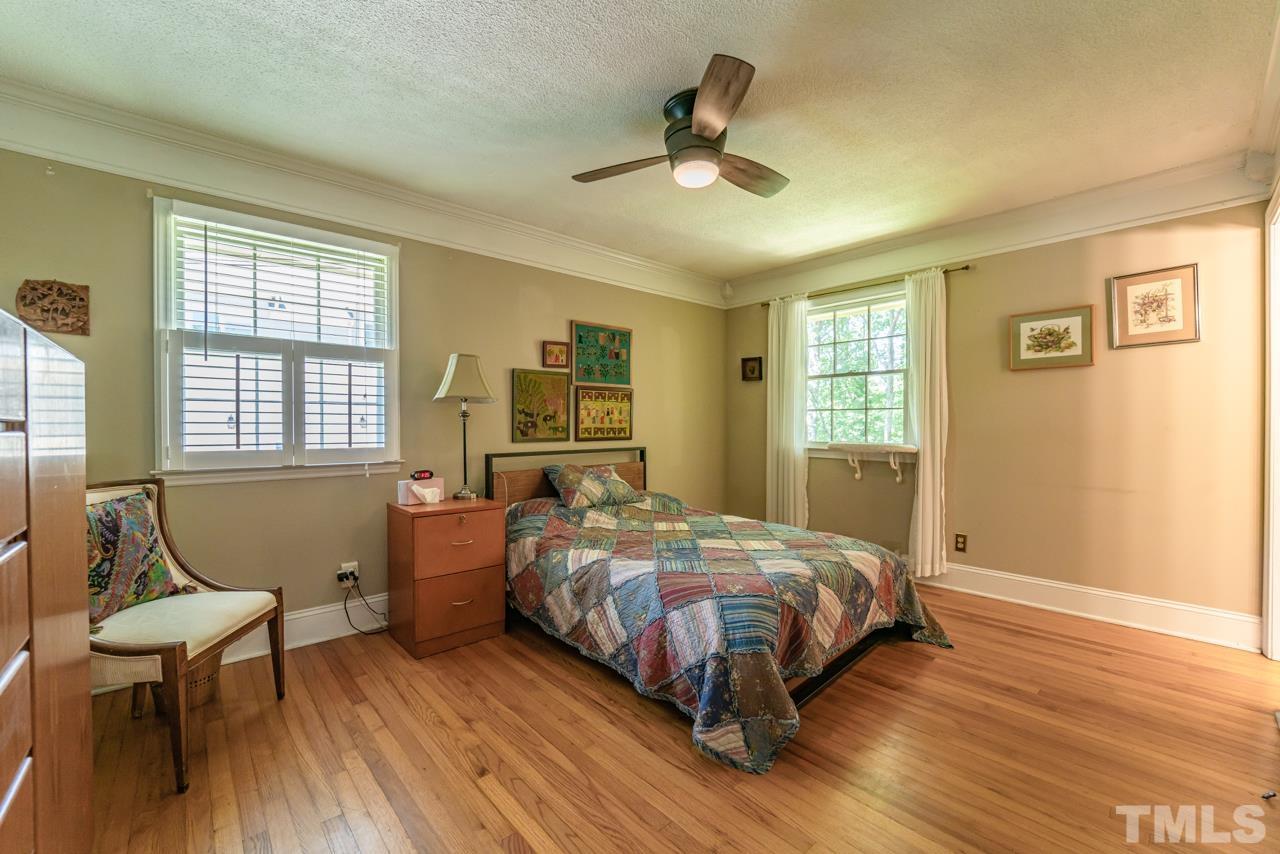 3318 Hampton Road Raleigh, NC 27607 - Photo 35 of 56 a bedroom with a bed and wooden floor