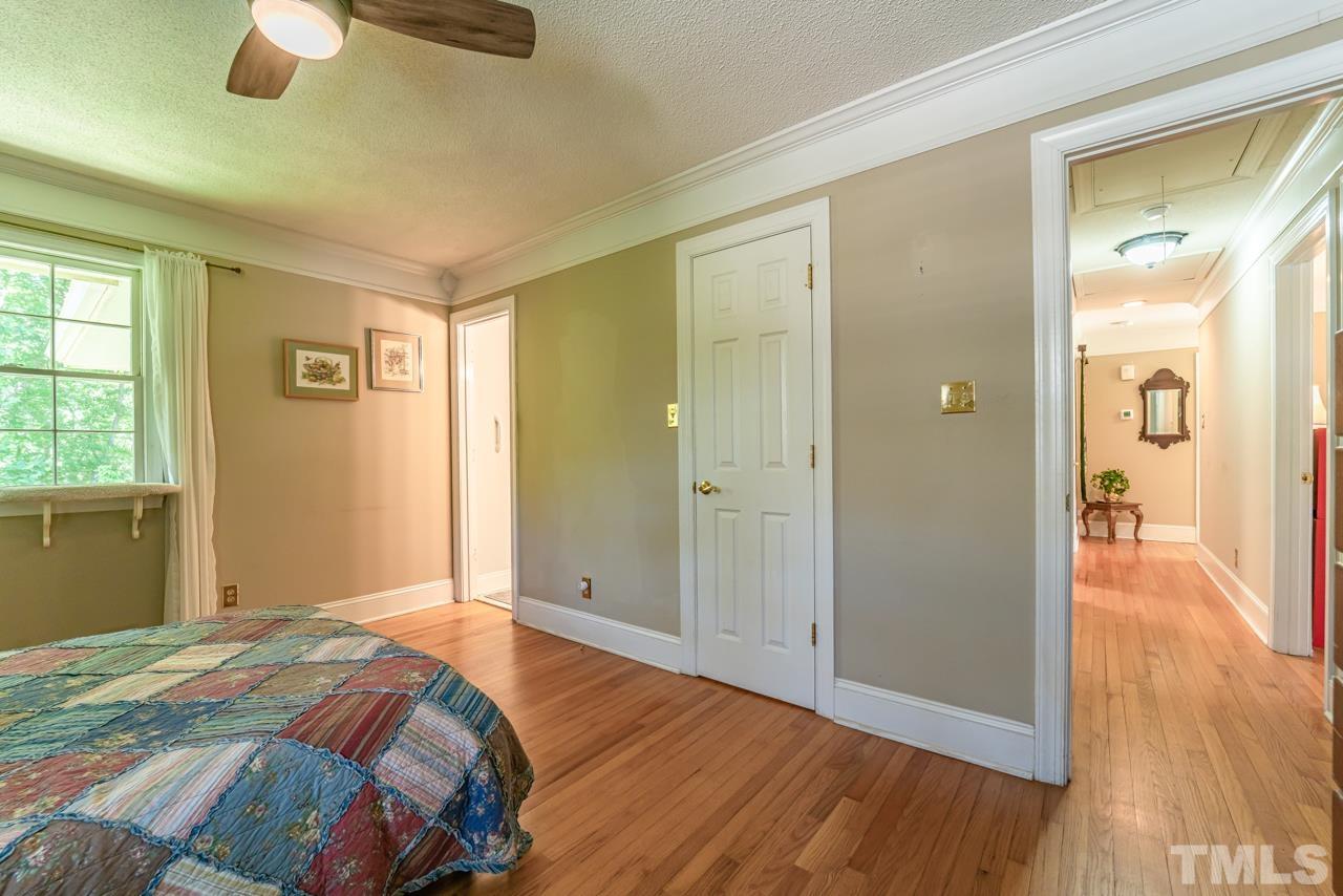 3318 Hampton Road Raleigh, NC 27607 - Photo 36 of 56 a bedroom with a bed and wooden floor
