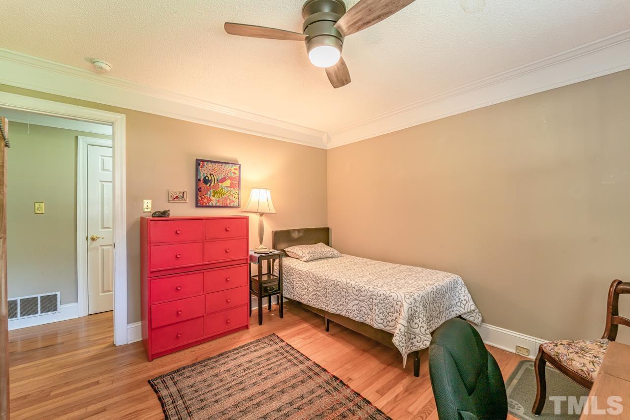 3318 Hampton Road Raleigh, NC 27607 - Photo 38 of 56 a bedroom with a bed and a dresser