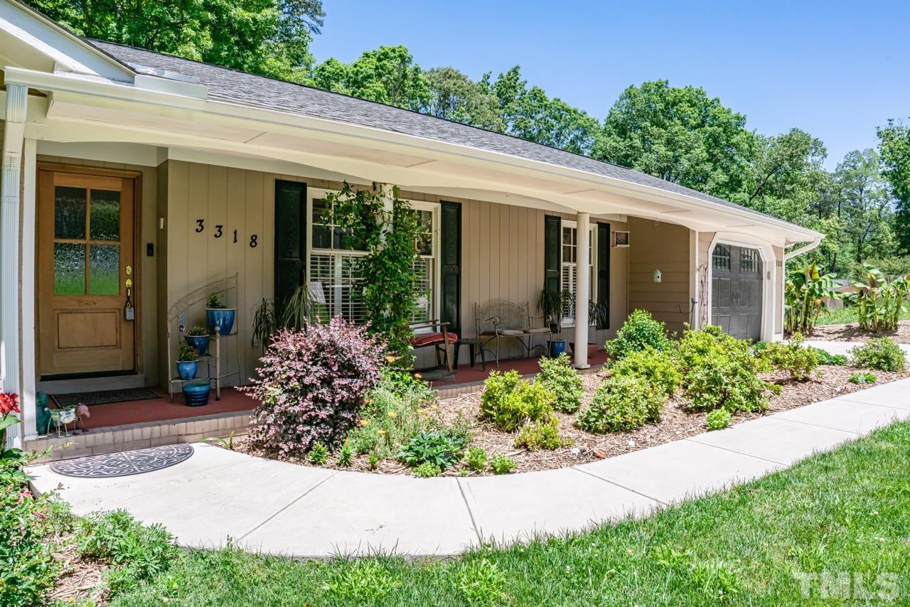 3318 Hampton Road Raleigh, NC 27607 - Photo 4 of 56 a front view of a house with garden