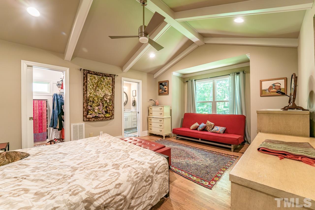 3318 Hampton Road Raleigh, NC 27607 - Photo 42 of 56 a bedroom with a bed and a couch