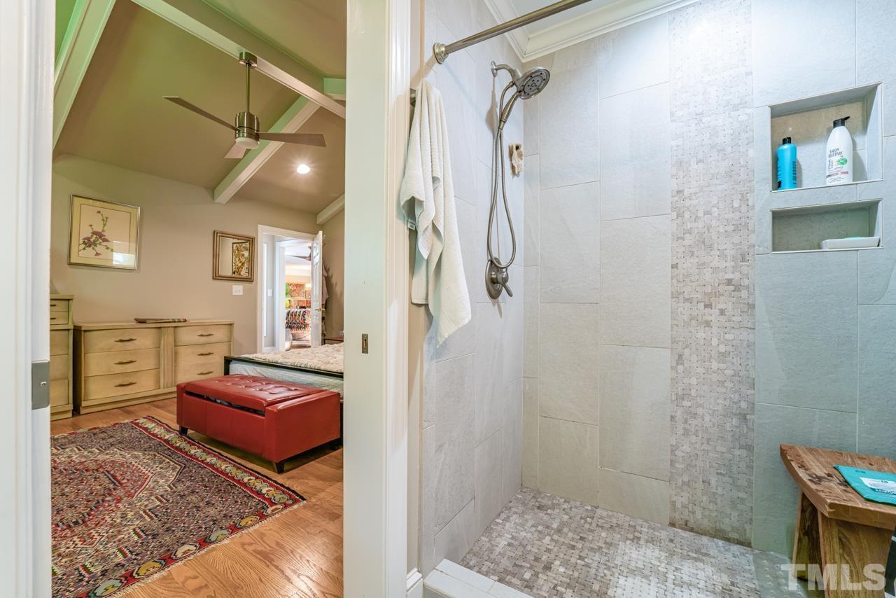 3318 Hampton Road Raleigh, NC 27607 - Photo 46 of 56 a spacious bedroom with a bed and a shower